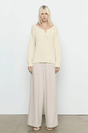 Allure Sweater Soft Yellow by Sovere Studio – Soft, breathable 100% cotton knit with wide 'V' neckline, dropped shoulders, long sleeves, and ribbed finish. Relaxed fit, perfect for layering.