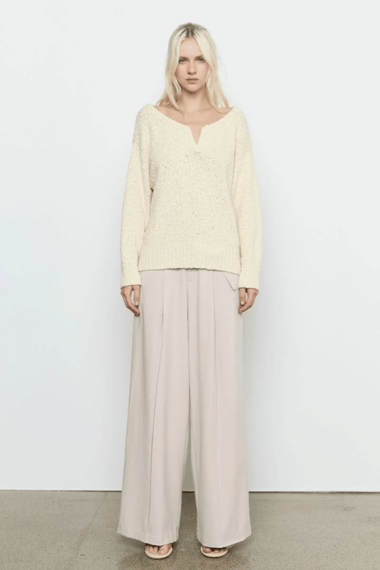 Allure Sweater Soft Yellow by Sovere Studio – Soft, breathable 100% cotton knit with wide 'V' neckline, dropped shoulders, long sleeves, and ribbed finish. Relaxed fit, perfect for layering.
