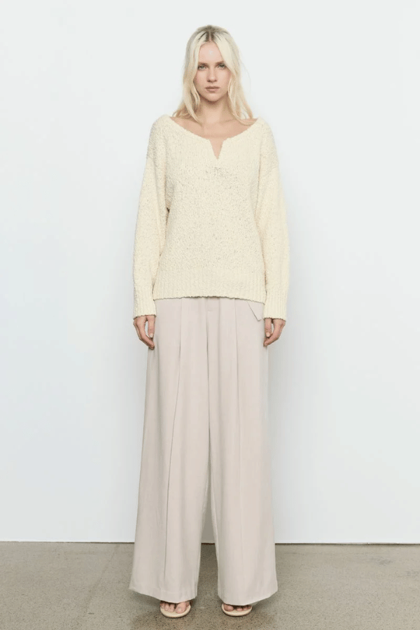 Allure Sweater Soft Yellow by Sovere Studio – Soft, breathable 100% cotton knit with wide 'V' neckline, dropped shoulders, long sleeves, and ribbed finish. Relaxed fit, perfect for layering.