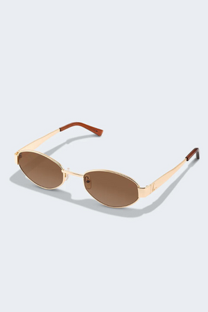 MU 52YS Brass Gold w, dark brown by Miu Miu, oval metal frame in pale gold with grey gradient polyamide lenses, narrow fit, high bridge nosepads for style and comfort.