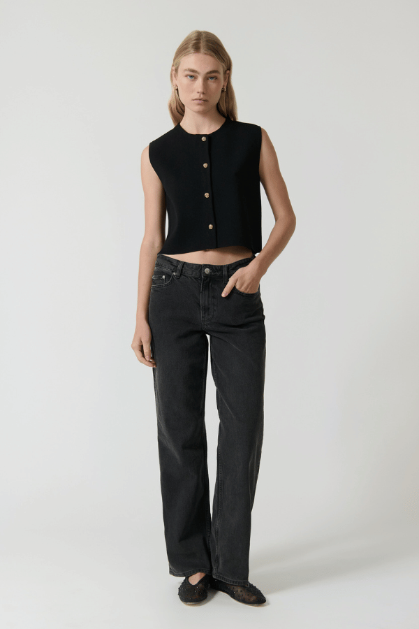 Linda Gilet Black by Onte – Trendy crochet-style knit gilet in breathable cotton with gold buttons and patch pockets, perfect for layering day-to-night.