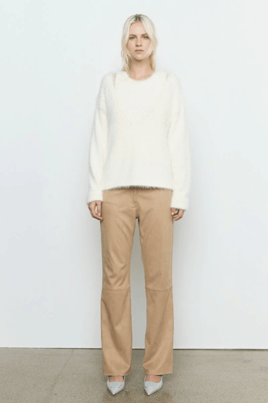 Sabado Combo Knit Cream by Sovere – Trendy two-piece knit set with a fluffy V-neck sweater and ribbed tank, perfect for layering in casual or chic looks.