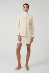 Helena Jacket Ivory by Onte – Breathable 100% cotton crochet-knit jacket with loose fit, gold buttons, crew neck, long sleeves, and patch pockets. Hand wash cold, dry flat.
