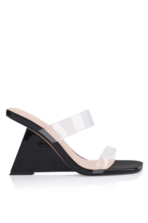 Brooke Wedge Black Patent by Lana Wilkinson – Sculptural black patent leather sandal with clear vinylite straps, high 10cm wedge heel, and feminine square toe.