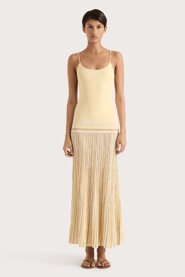 Citara Maxi Dress Butter Stripe by Faithfull the Brand – Trendy ribbed knit maxi with adjustable straps and backless tie, perfect for effortless summer elegance and beach days.