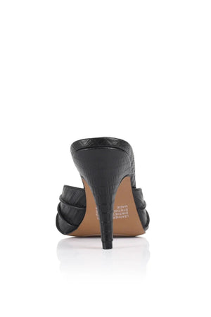 Carrie Mule by Lana Wilkinson, black lizard-embossed leather with gathered straps and stiletto heel. Perfect for chic day-to-night wear.