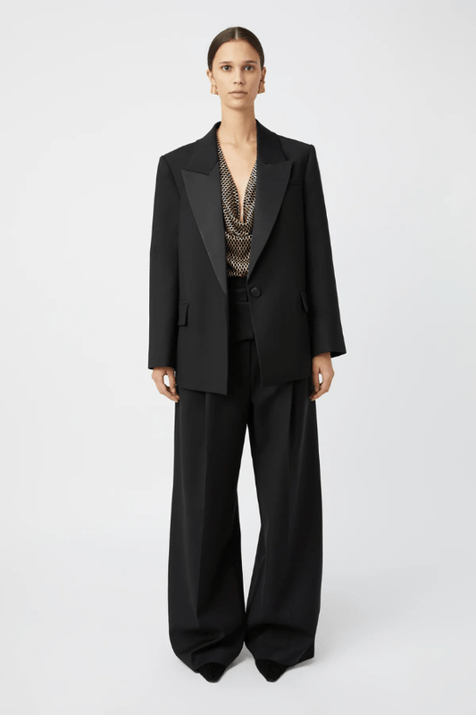 Natalini Blazer Black by Camilla and Marc – Elegant blazer crafted from luxurious Australian wool with sleek satin lapels, forward-rolling shoulders, and a raised swinging back hem.