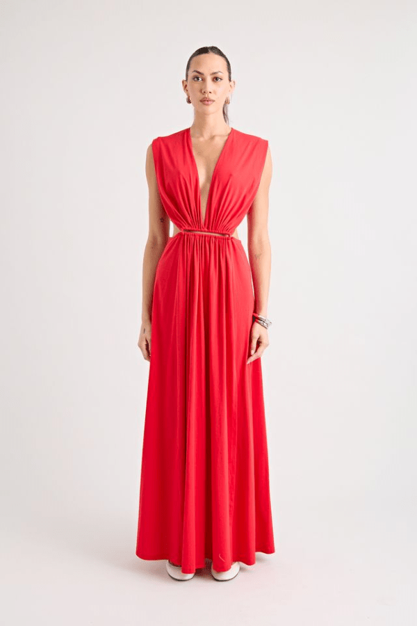 Do For Love Gown Red by Pfeiffer – A trendy low plunge maxi gown with bold hardware and thigh-high split, perfect for turning heads at special occasions.