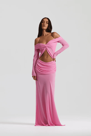 Emily Gown Candy Pink by Natalie Rolt – A trendy, ethereal georgette gown with off-shoulder draping and fluid bias cut, perfect for special occasions and statement-making moments.