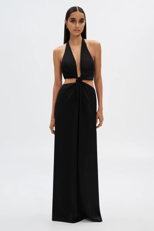 The Wander Satin Gown Black by Misha – A timeless, elegant maxi gown in lightweight satin with a flattering twisted front detail, perfect for warm evening events.