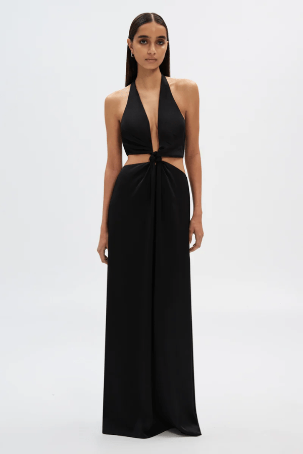 The Wander Satin Gown Black by Misha – A timeless, elegant maxi gown in lightweight satin with a flattering twisted front detail, perfect for warm evening events.