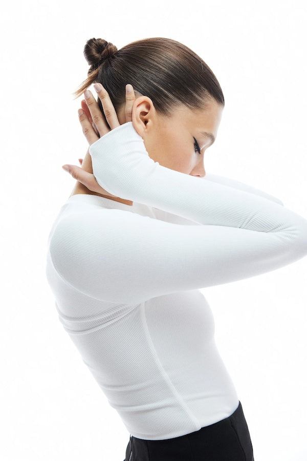 The Brooklyn Top White by Mossman, lightweight and super soft knitwear with thumb sleeve openings and a high round neckline, perfect for trendy layering days.