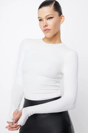 The Brooklyn Top White by Mossman, lightweight and super soft knitwear with thumb sleeve openings and a high round neckline, perfect for trendy layering days.