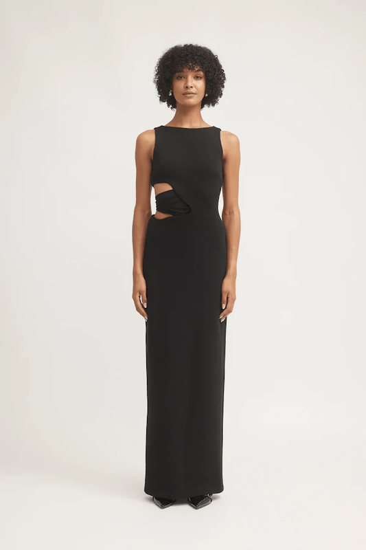 Valentina Dress Black by Tojhà – Sleek crepe maxi with curved waist cut-out and mesh detail, perfect for formal nights or chic events.