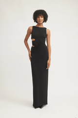 Valentina Dress Black by Tojhà – Sleek crepe maxi with curved waist cut-out and mesh detail, perfect for formal nights or chic events.