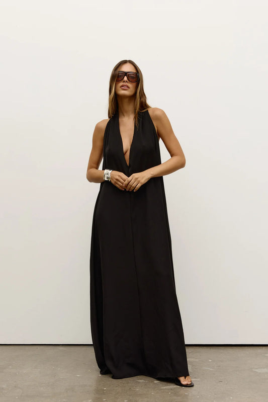Willow Dress by Bayse, a sleek halter-neck maxi with fluid drape and side pockets, perfect for effortless day-to-evening wear.