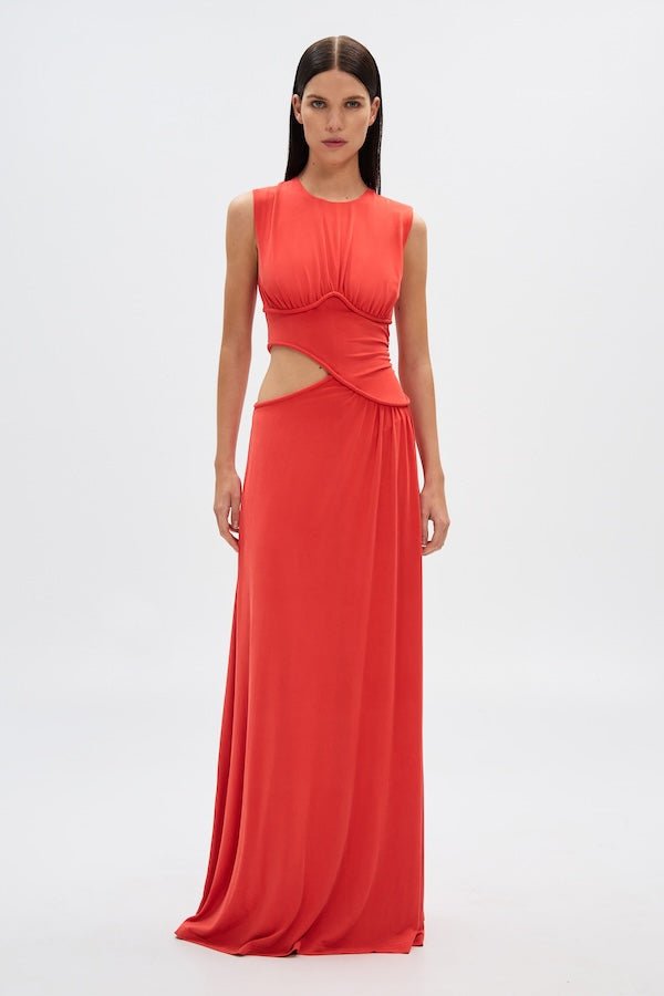 Sierra Jersey Gown Tomato Red by Misha – A trendy, sophisticated maxi with hand-twisted cords and soft pleated jersey, perfect for elegant occasions and casual glam.
