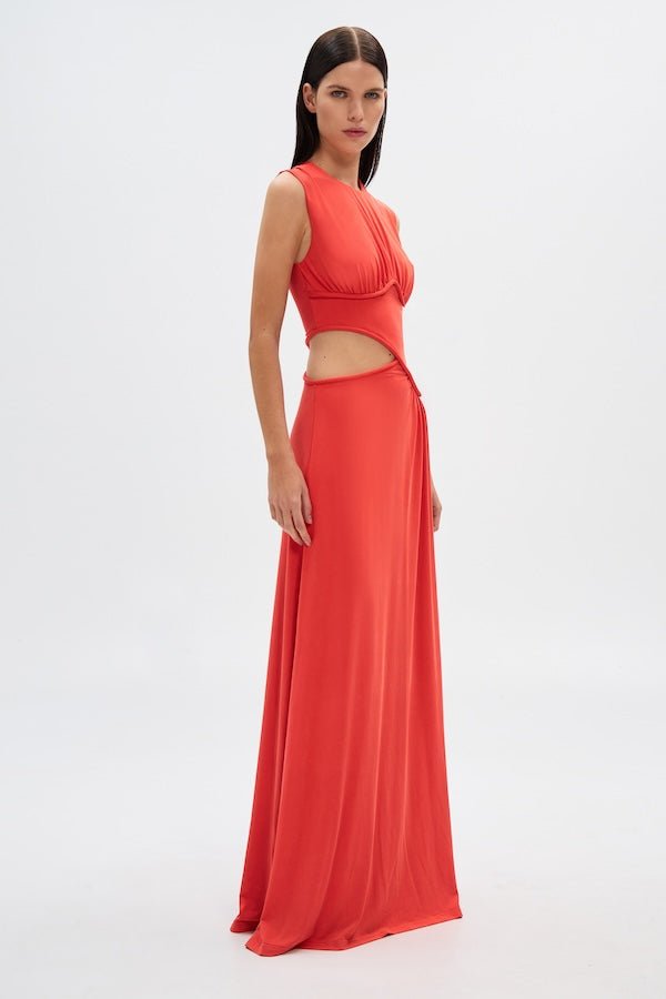 Sierra Jersey Gown Tomato Red by Misha – A trendy, sophisticated maxi with hand-twisted cords and soft pleated jersey, perfect for elegant occasions and casual glam.