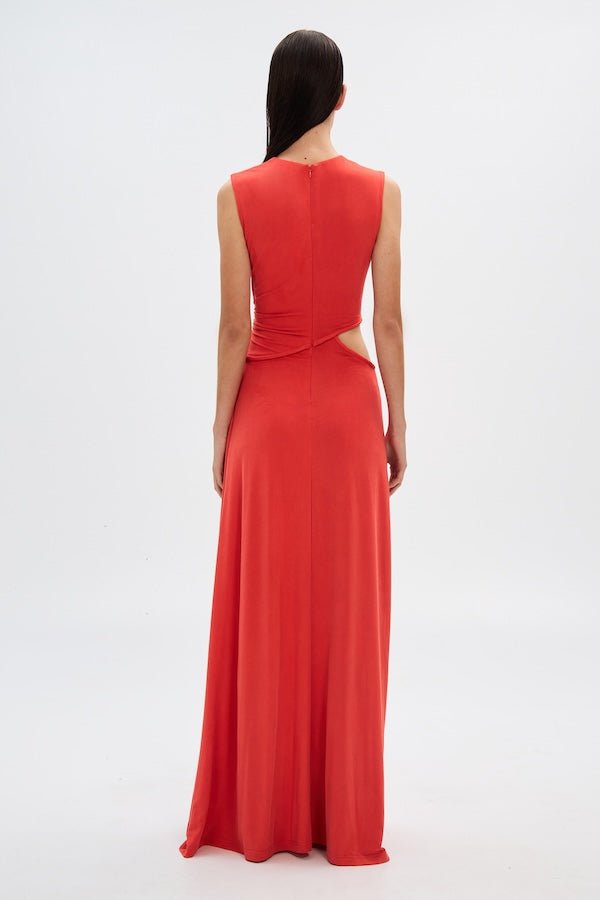 Sierra Jersey Gown Tomato Red by Misha – A trendy, sophisticated maxi with hand-twisted cords and soft pleated jersey, perfect for elegant occasions and casual glam.