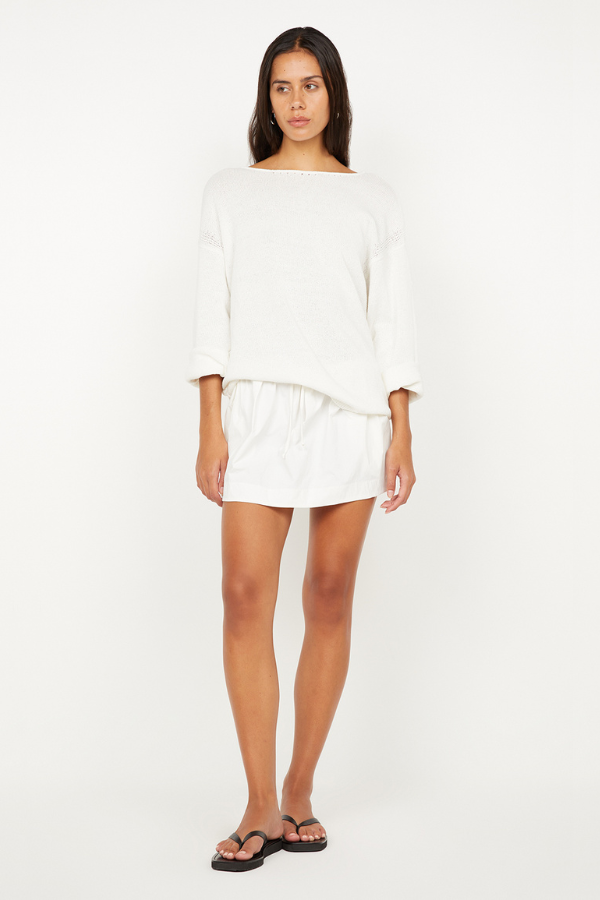 Dante Mini Skirt in Ivory by Bec + Bridge, stretch nylon mini with drawstring waist and gathered finish. Perfect for easy everyday styling.