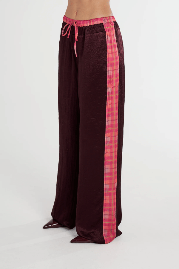 Boxer Pant Plum by Summi Summi, relaxed wide-leg pant with drawstring waistband and NEON PLAID side panels for a stylish, comfortable fit. Made from 100% acetate woven fabric.