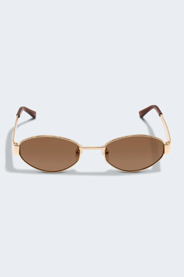 MU 52YS Brass Gold w, dark brown by Miu Miu, oval metal frame in pale gold with grey gradient polyamide lenses, narrow fit, high bridge nosepads for style and comfort.