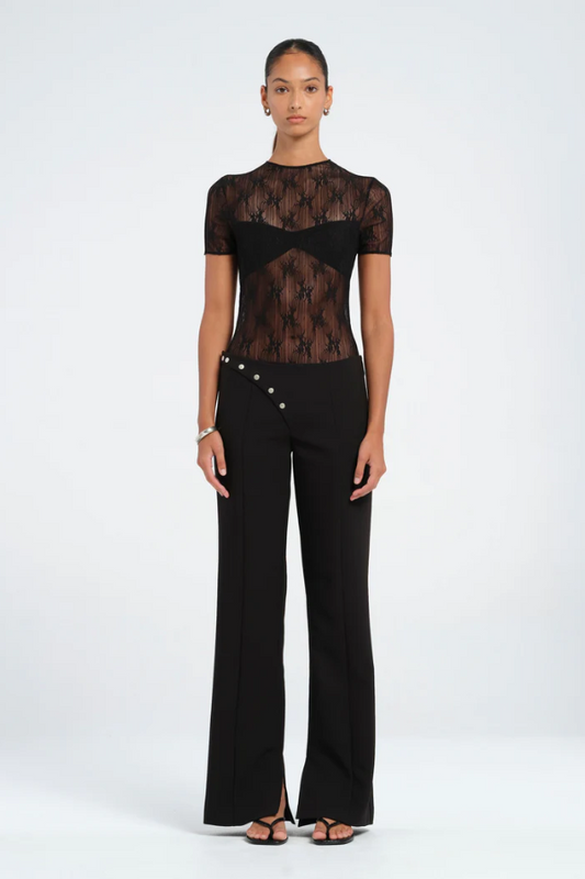 Porter Bodysuit Black by Benni — Stretch lace bodysuit with high neck, soft jersey lining, open back, hook-and-eye clasp, and snap crotch closure for a sleek, practical fit.
