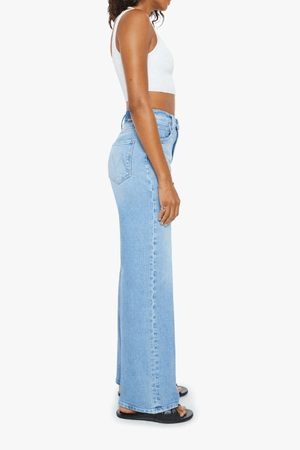 The Lasso Sneak Sow Surreal by MOTHER, trendy super high-rise wide-leg jeans with a light blue wash, whiskering, and fading. Perfect for a vintage-inspired look with a clean hem and structured fit.