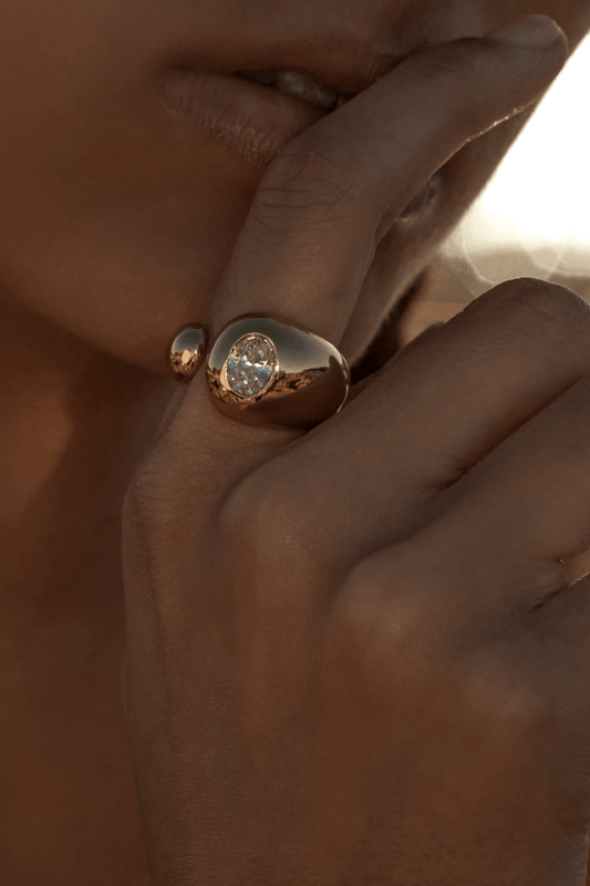 Vesper Ring Gold by Amber Sceats, sculptural curved design with sparkling cubic zirconia, handcrafted in Italy for a chic, viral statement piece.