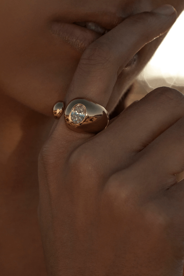 Vesper Ring Gold by Amber Sceats, sculptural curved design with sparkling cubic zirconia, handcrafted in Italy for a chic, viral statement piece.