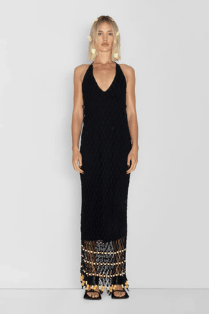 Reis Macrame Maxi Dress Noir by The Wolf Gang – Striking handmade black macrame dress with beaded hem, ideal for festivals or summer soirées.