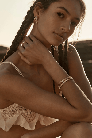 Gisele Earrings by Amber Sceats, trendy double hoop design with AAA+ freshwater pearls, handcrafted in Italy for timeless elegance and sophistication.