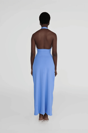 Vaupés Coast Blue by Maygel Coronel – Maxi dress with halter neck, open back, 3D flowers, cutouts, ruched waist, and skirt.