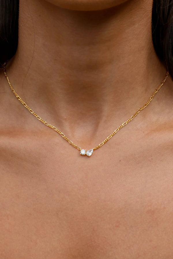 Twin Flame Necklace by Avant Studio in 18k gold plated sterling silver with cubic zirconia and adjustable chain.