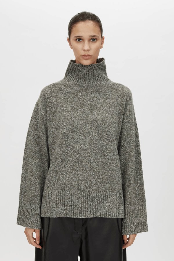 Breccia Knit Sweater Khaki by Camilla and Marc – Trendy oversized merino wool sweater with ribbed details and a modern split back, perfect for casual layering.