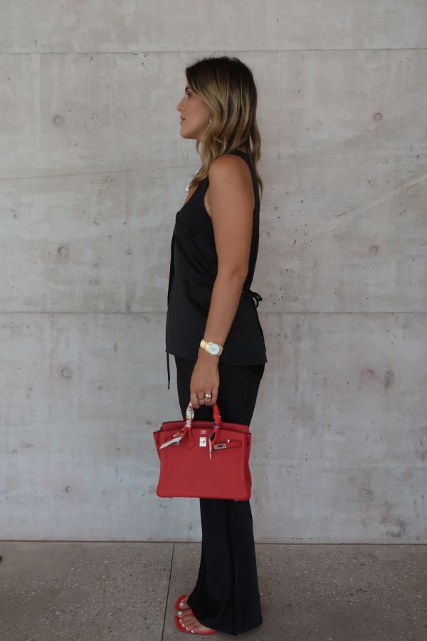 Maja Vest Noir by Sneaky Link, luxurious noir satin vest with drawstring tie and front buttons, perfect for trendy viral layering and polished day-to-night looks.