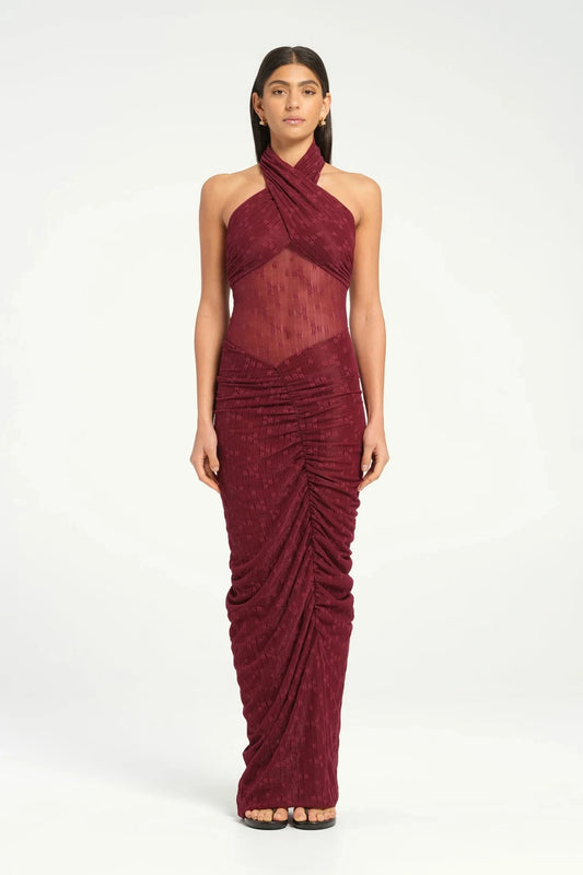 Hudson Lace Maxi Dress Sangria by Benni, sensual stretch lace with twist halter neckline, ruched seams, sheer waist panel for a bold evening look.