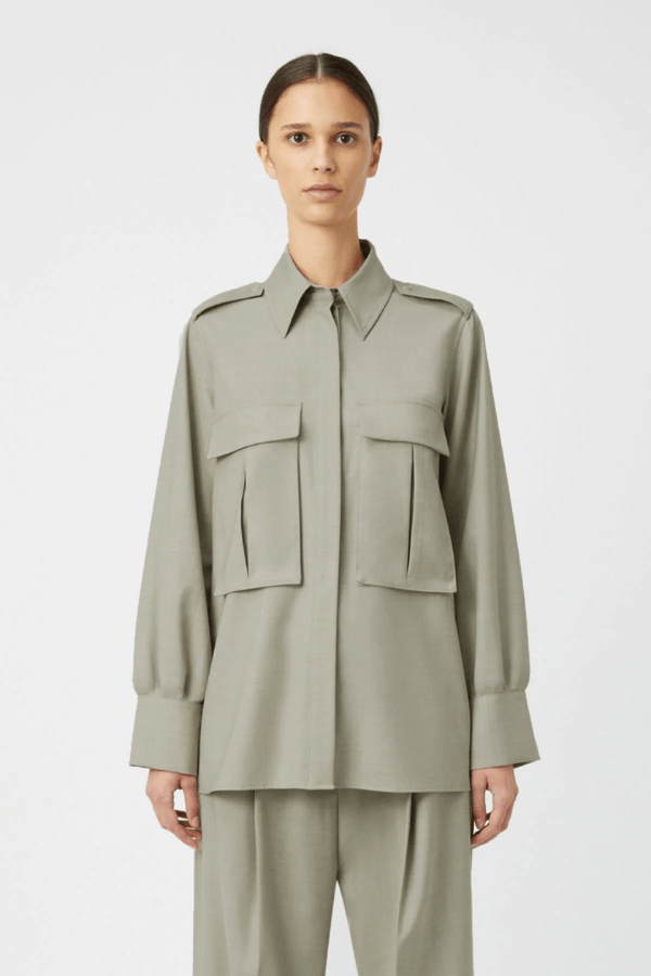 Drew Shirt Mottled Stone by Camilla and Marc – Oversized boxy shirt with 3D utility pockets, shoulder epaulettes with branded buttons, and concealed button placket. Crafted in soft wool-poly blend.
