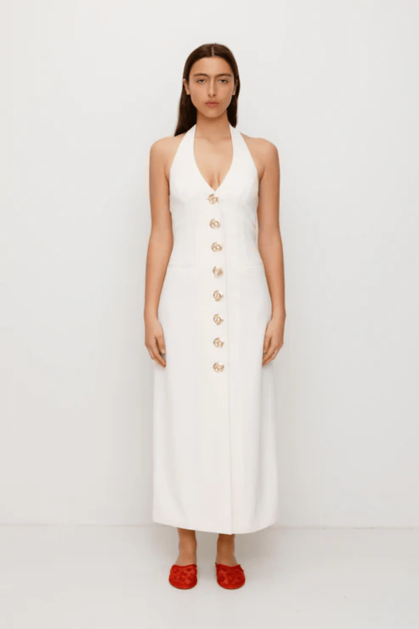 Irida Maxi Dress Ivory by The Wolf Gang – A trendy fitted maxi with halter neckline and gold swirl details, perfect for timeless elegance at special occasions.