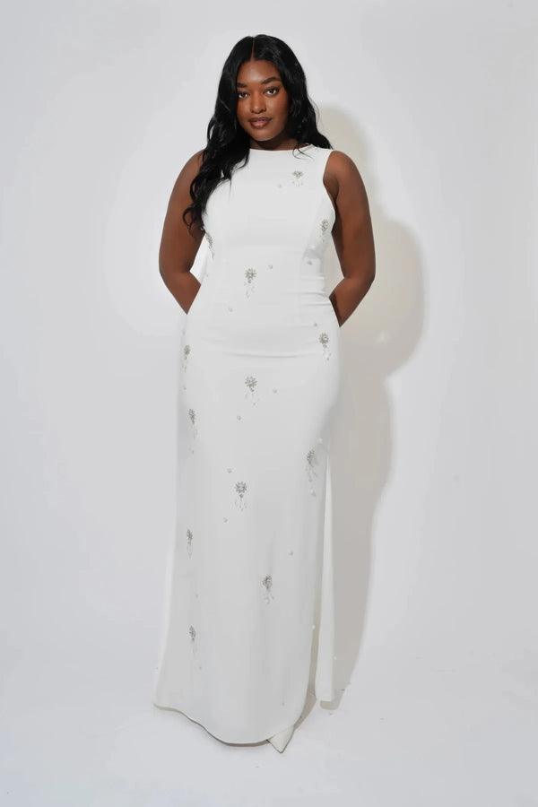 Crystal Maxi Dress by Odd Muse, a white bridal maxi with crystal and pearl detailing, high neckline and elegant fitted silhouette.
