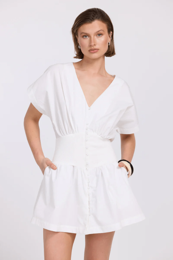 Versed Mini Dress Chalk by Sovere – A trendy and modern mini with a soft lyocell blend, structured contrast waistband, and gathered skirt, perfect for chic day-to-night looks.