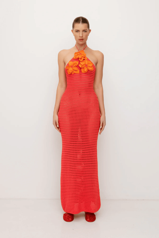 La Monada Knit Maxi Dress Coral by The Wolf Gang – A trendy one-shoulder knit maxi with bold cut-out, thigh-high split, and sculpted fit, perfect for casual or chic occasions.