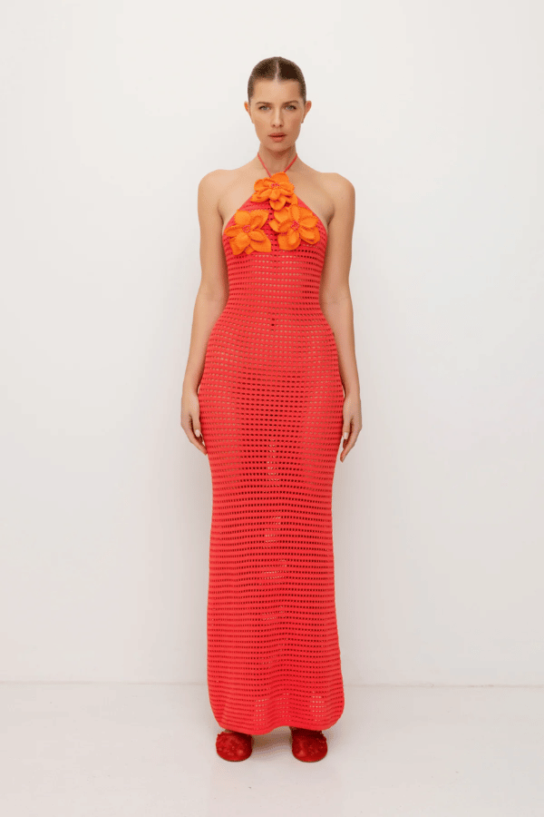 La Monada Knit Maxi Dress Coral by The Wolf Gang – A trendy one-shoulder knit maxi with bold cut-out, thigh-high split, and sculpted fit, perfect for casual or chic occasions.