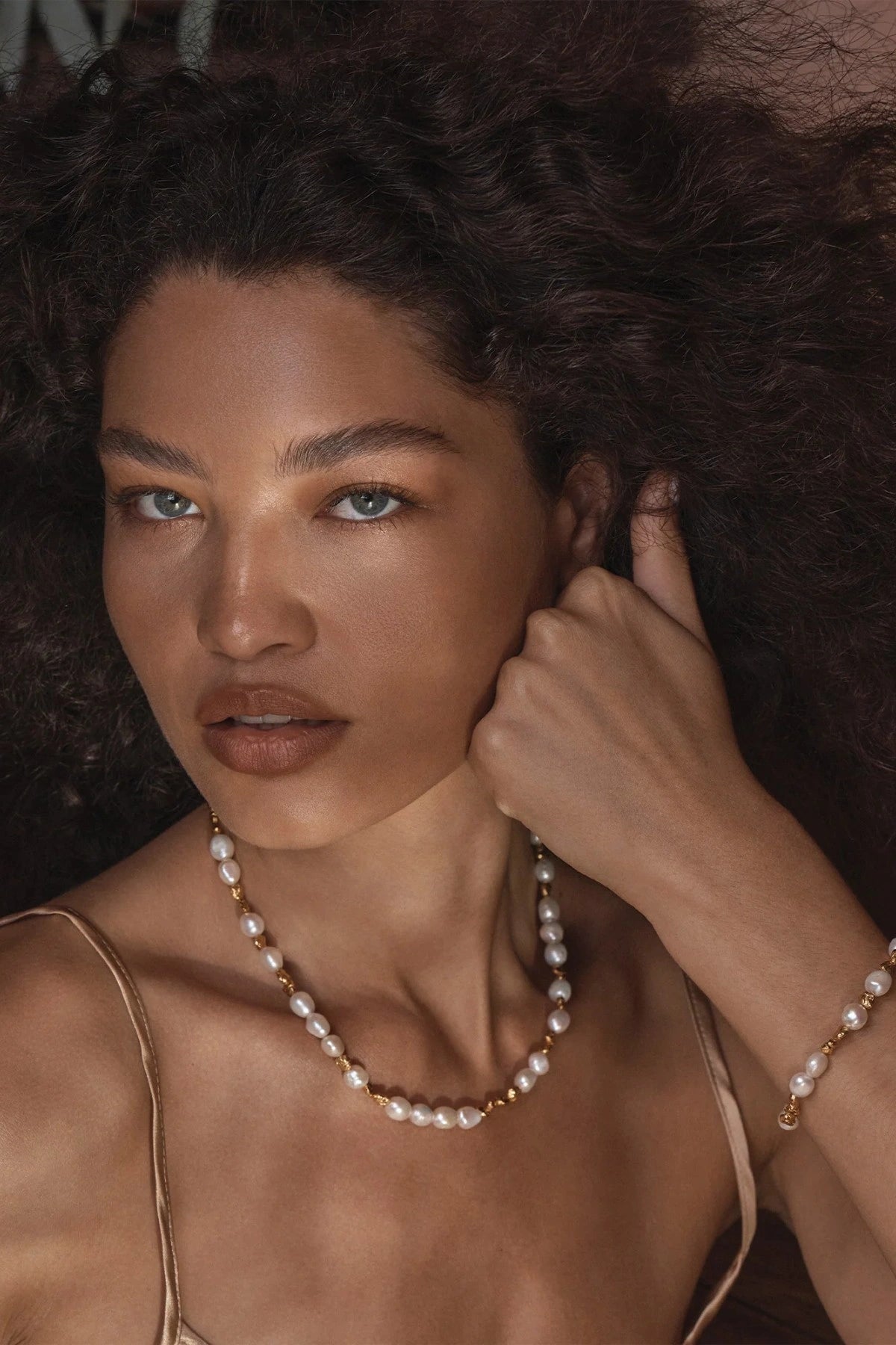 ChatGPT said:

Portofino Necklace by Amber Sceats, handcrafted in Italy with AAA+ freshwater pearls and 24K gold-plated beads for timeless sophistication.