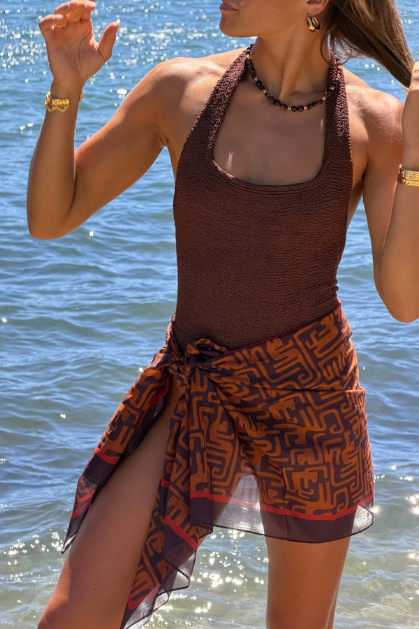 Sandy Swim by Hunza G, shimmering halter swimsuit in metallic crinkle fabric that stretches to flatter every curve.