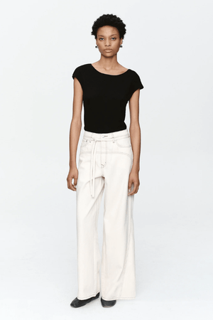 Tie Curve Seam Jean Ecru by Marle, trendy mid-rise jeans with unique curved seam detailing and a relaxed, wide-leg fit. Perfect for a versatile, structured look with a detachable tie belt.