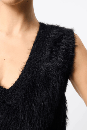 Slumber Vest Black by Mossman – Cozy yet chic high-loft knit vest with relaxed fit and V-neckline, perfect for layering or standalone style.