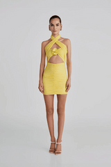 Quimera Mini Dress Mimosa by Maygel Coronel – Versatile ruched mini with 3D floral, open back, and straps styled in multiple ways.
