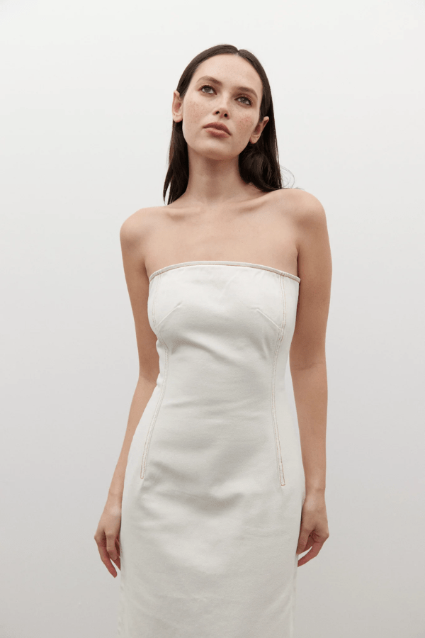 Amiri Denim Dress Angora by Bayse, a trendy, strapless denim dress with a corset-style bodice that sculpts your figure. Perfect for chic day-to-night looks.