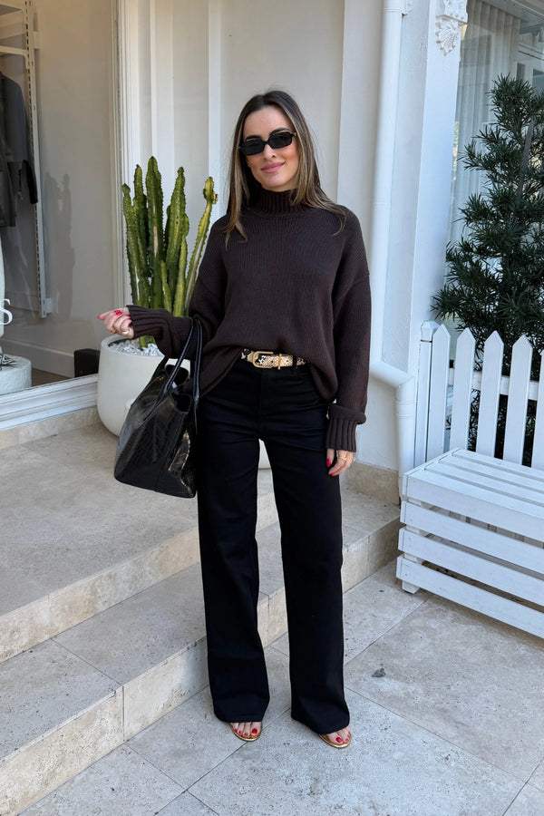 Celine High Rise Stretch Jeans in  jet black, featuring a slim fit and classic five-pocket design.